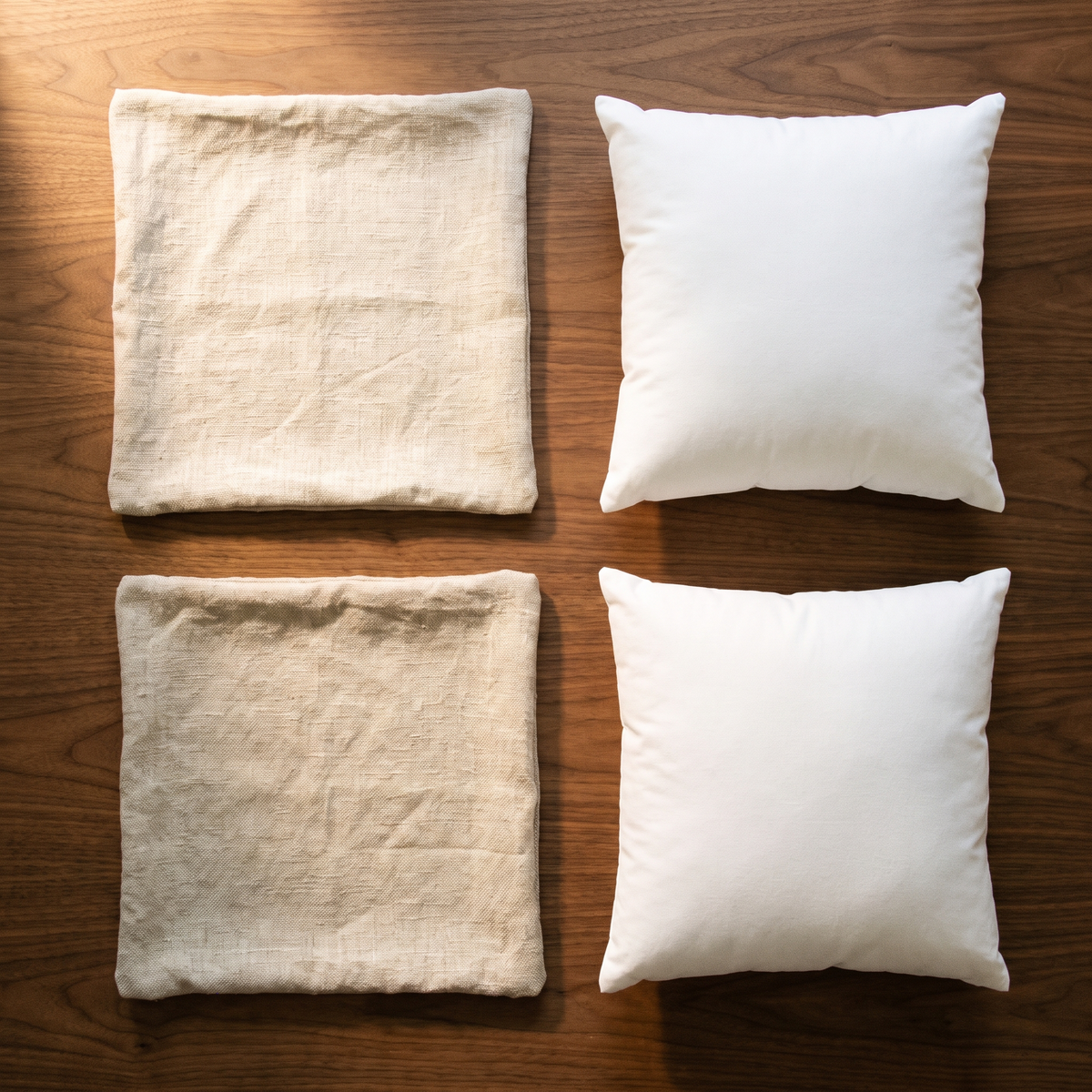 Natural linen 18x18 pillow covers with two white pillow inserts, flat lay