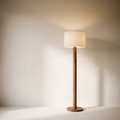 Walnut-tone floor lamp with linen-look drum shade