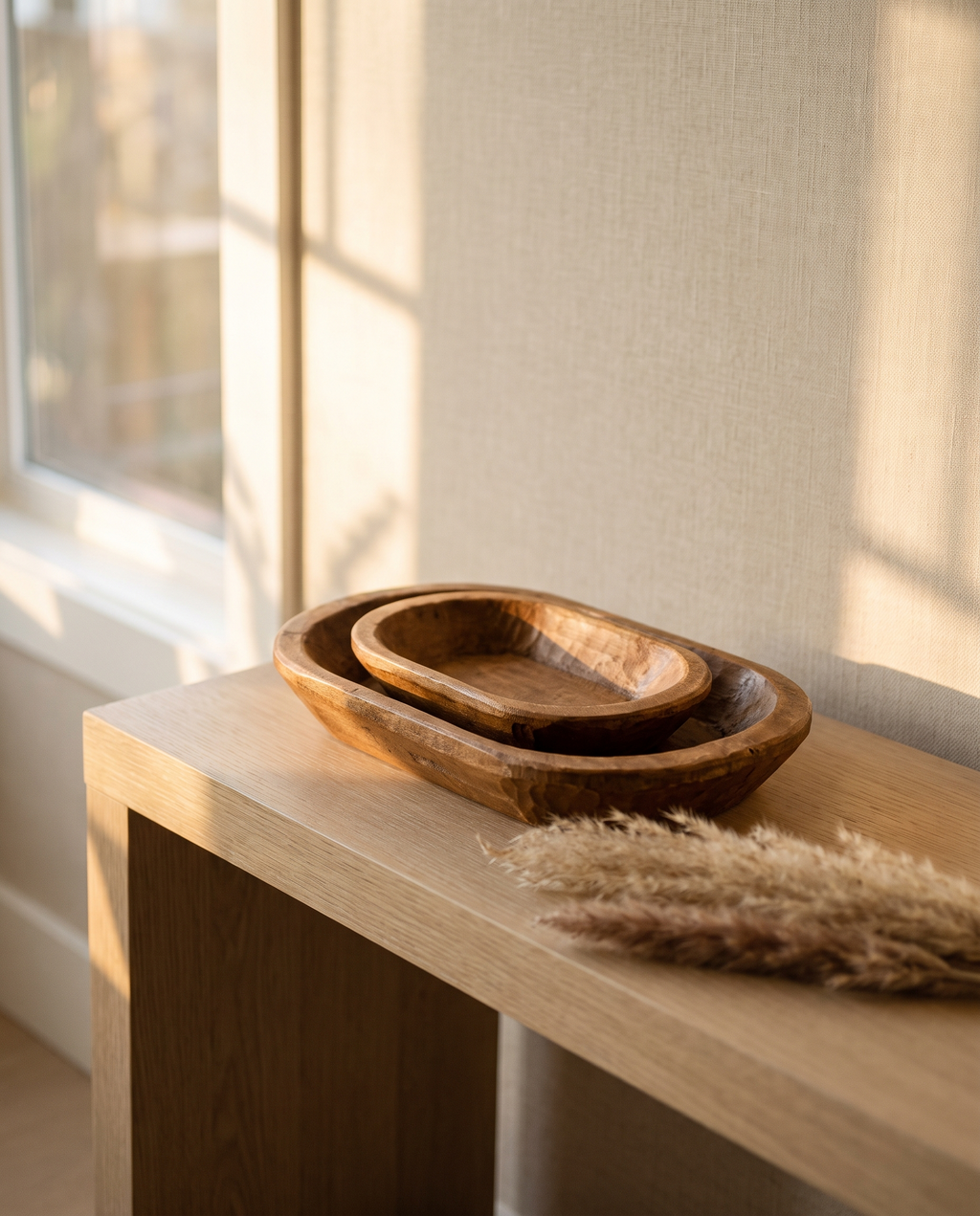 Nested paulownia dough bowls on an oak console